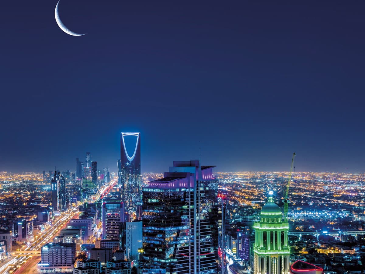 NIGHT TIME SHOT OF RIYADH WITH THE CRESCENT MOON RIGHT ABOVE IT